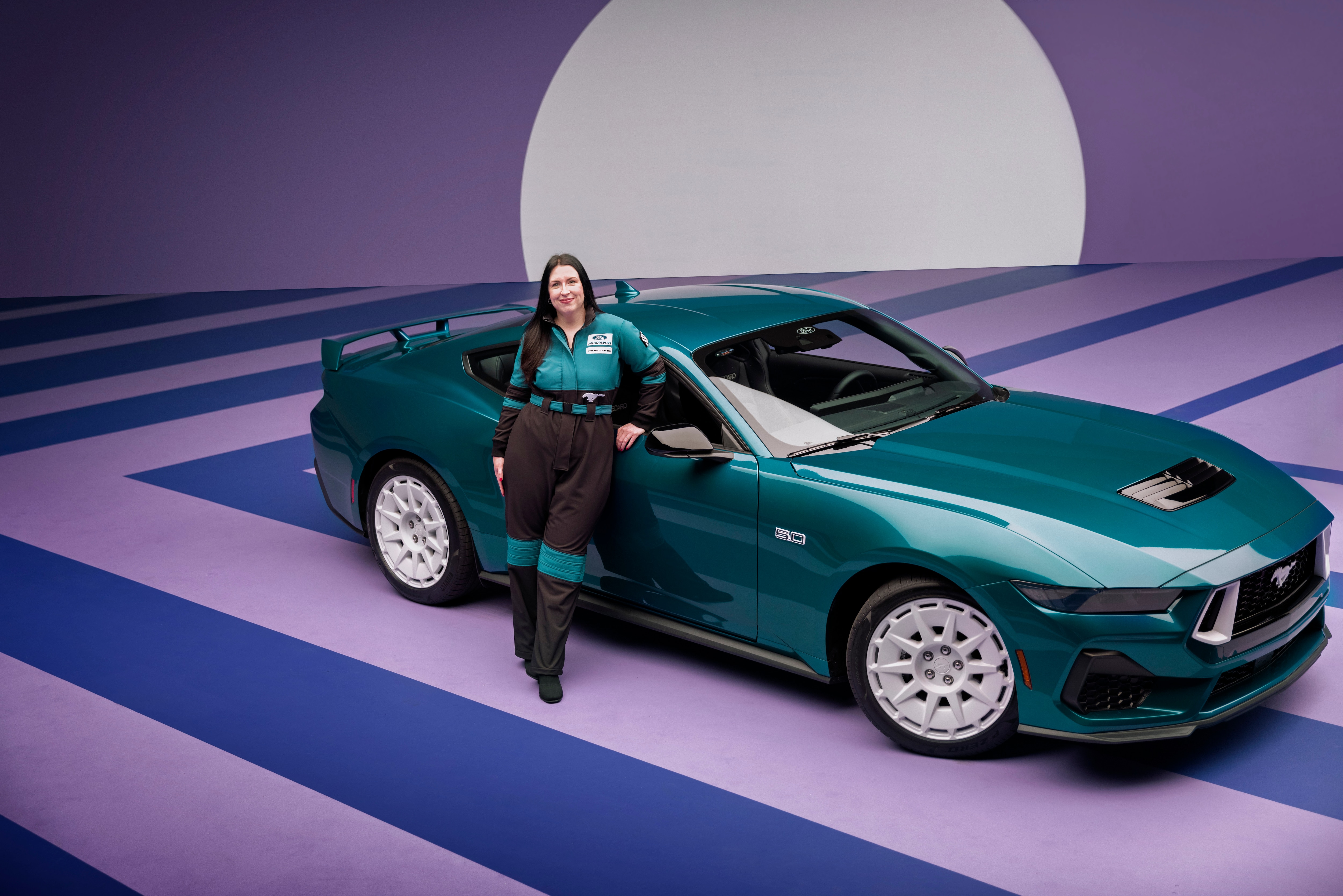 Designer Kristen Keenan alongside the 2026 Mustang FX Package. Preproduction model shown with optional equipment and extra cost color.